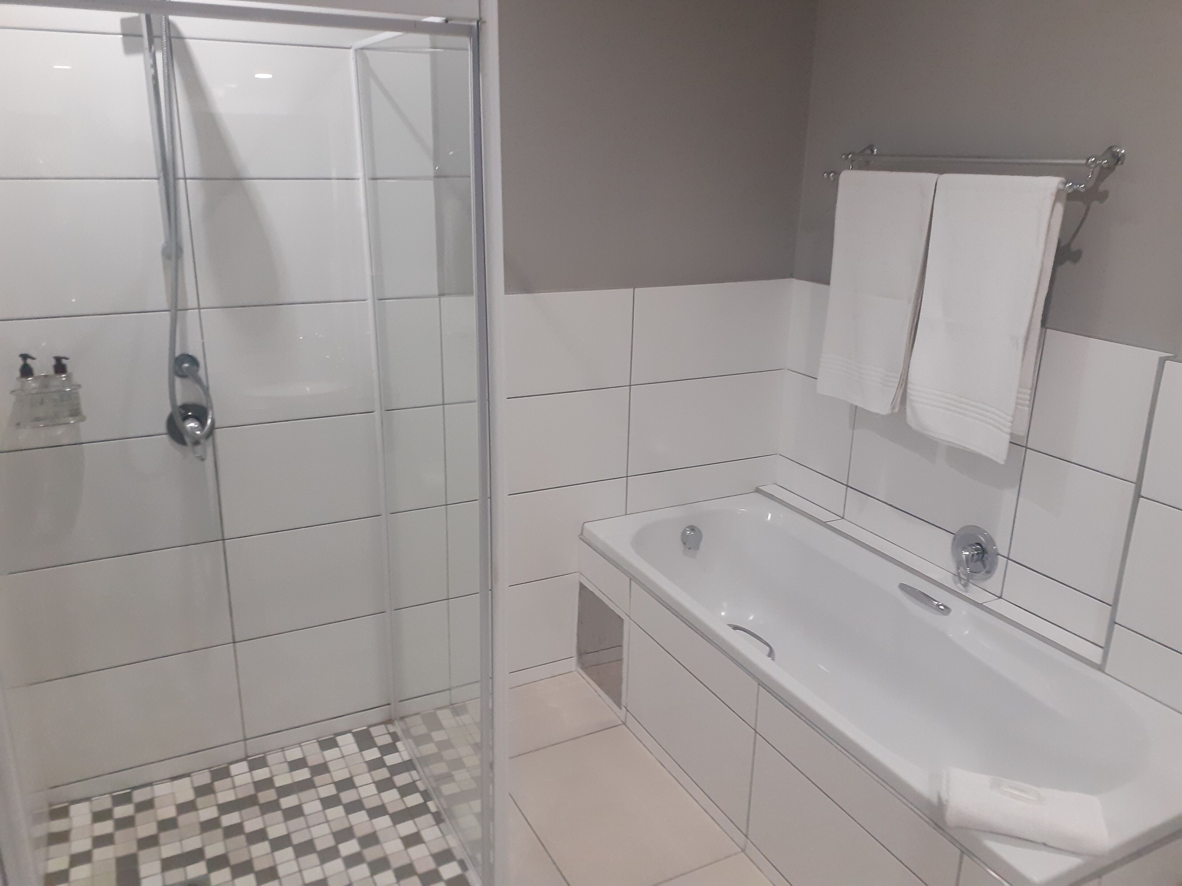 separate bathtub and shower, towels