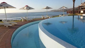 Outdoor pool, open 8:30 AM to 7 PM, pool umbrellas, pool loungers