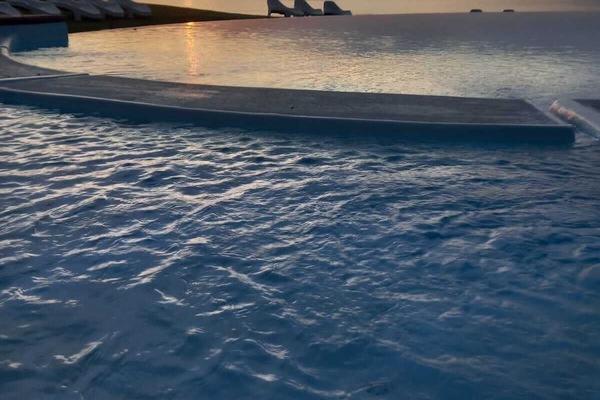 Outdoor pool, open 8:30 AM to 7 PM, pool umbrellas, sun loungers