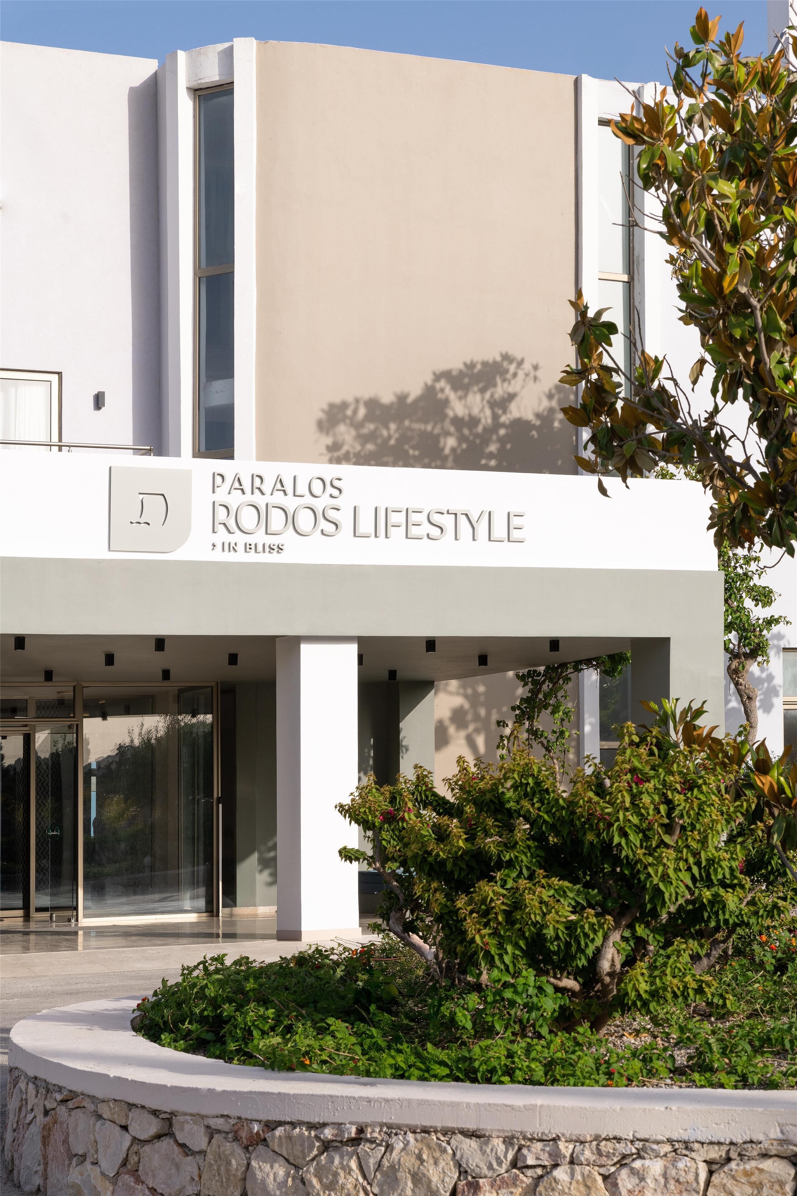 A modern building with a sign reading "Paralos Rodos Lifestyle."
