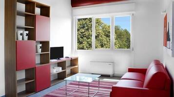 Superior Apartment | Living area | Flat-screen TV, first-run movies