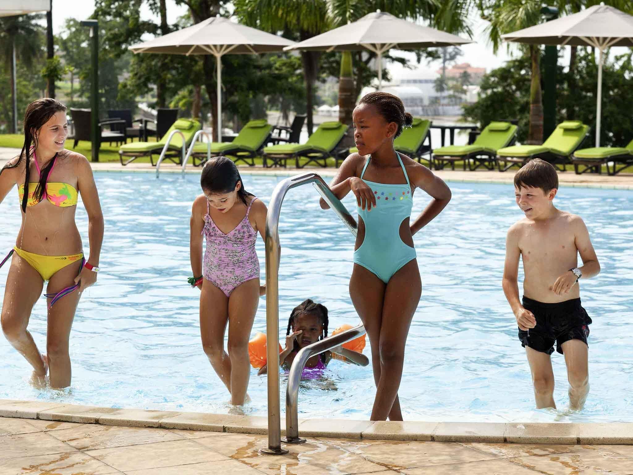 Outdoor pool, pool umbrellas, sun loungers