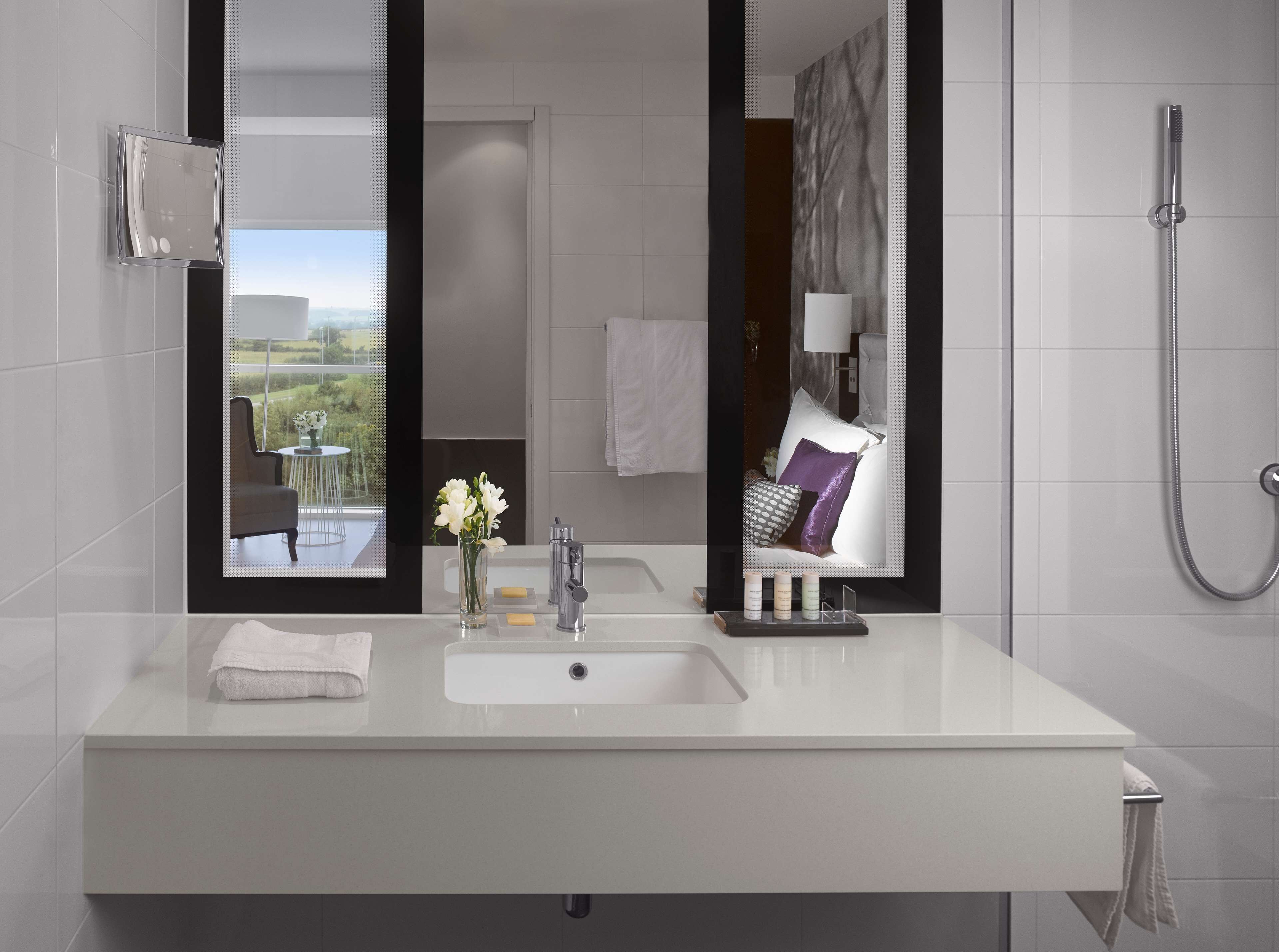 superior room (runway view) | bathroom | free toiletries, hair dryer, slippers, towels