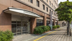 A hotel entrance with a clear sign reading "Washington Hotel Plaza". - Shimonoseki Station West Washington Hotel Plaza (Shimonoseki)