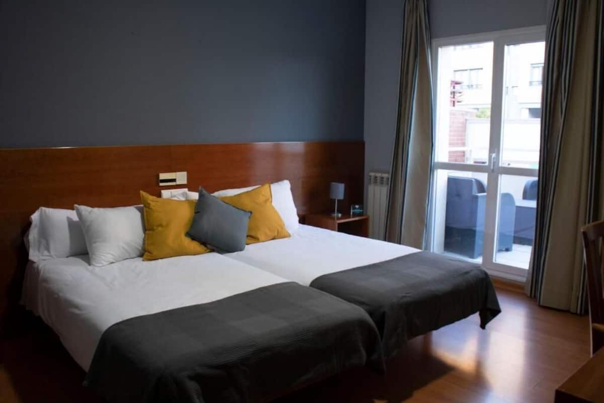Desk, blackout curtains, free WiFi, bed sheets