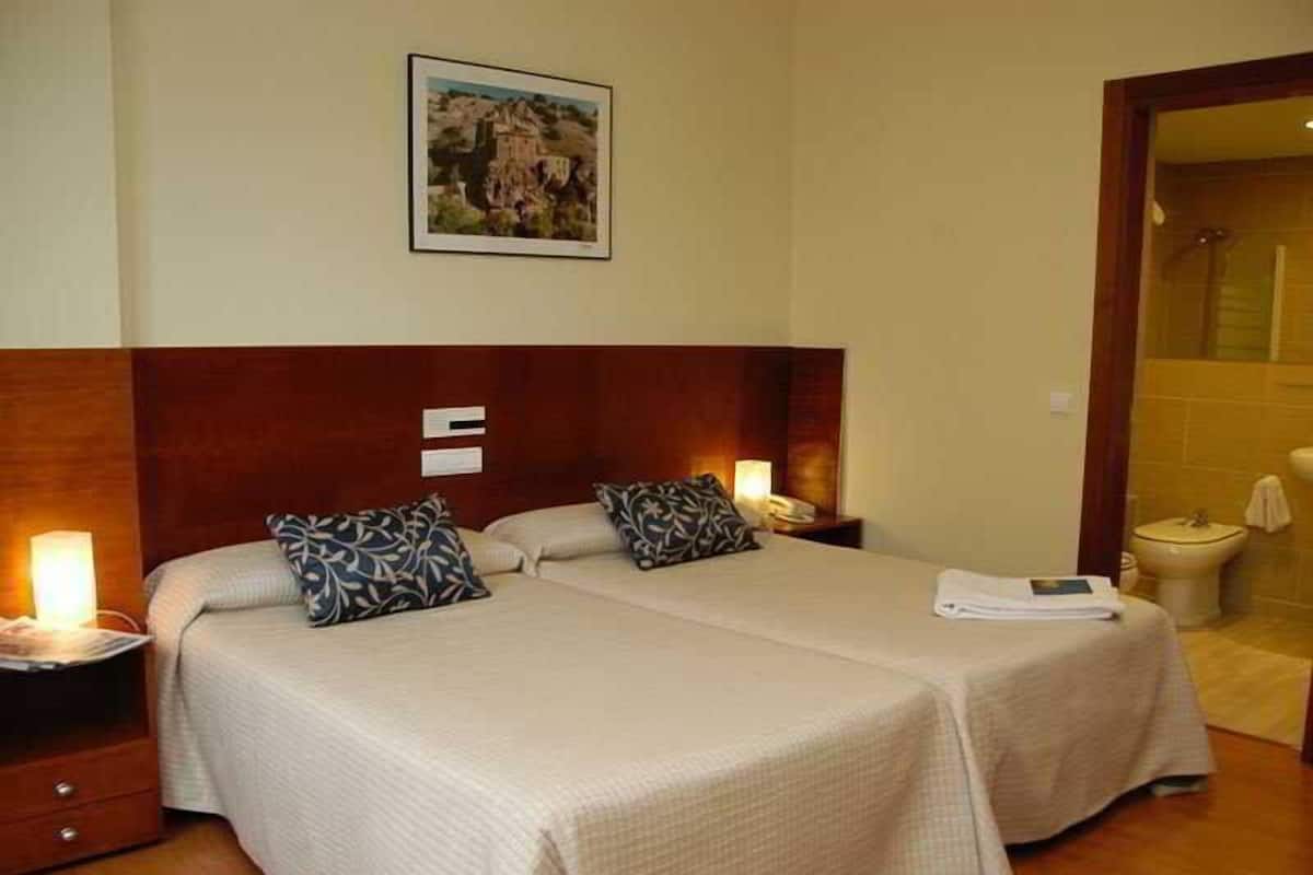 Desk, blackout curtains, free WiFi, bed sheets