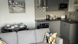 Apartment | Living area | Flat-screen TV - Duporth Guest House (Penzance)