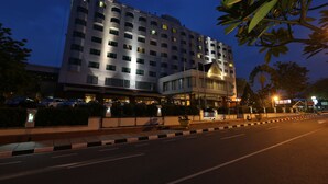 A multi-story hotel with a modern facade, illuminated windows, and a well-maintained exterior. - Aryaduta Pekanbaru (Pekanbaru)