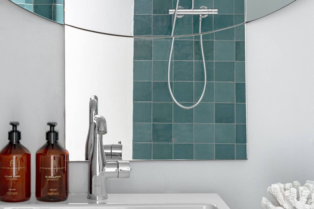 designer toiletries, hair dryer, bathrobes, slippers