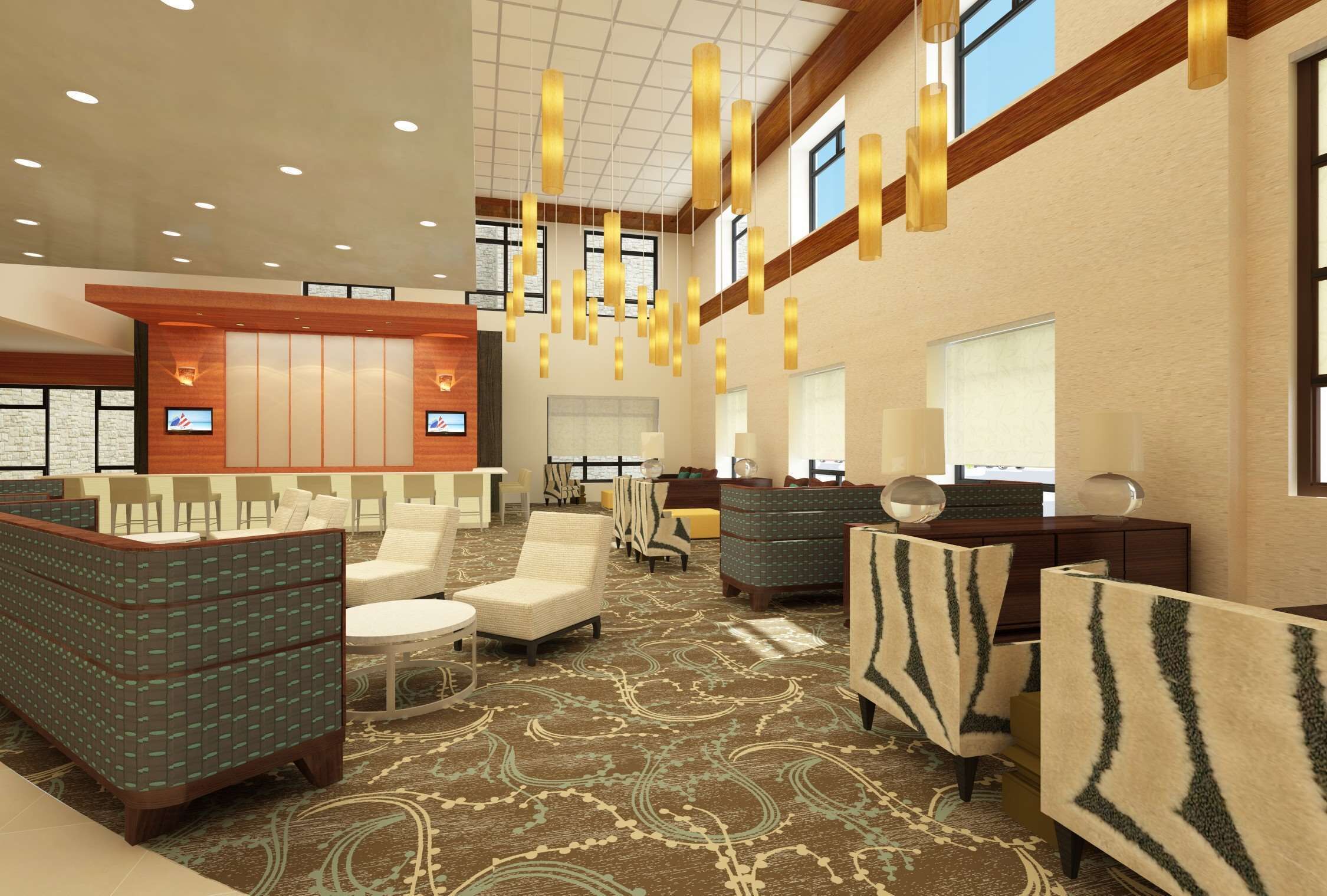 A hotel lobby with a reception desk, seating areas, and a patterned carpet.