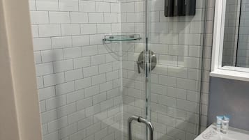 Shower, rainfall showerhead, designer toiletries, hair dryer
