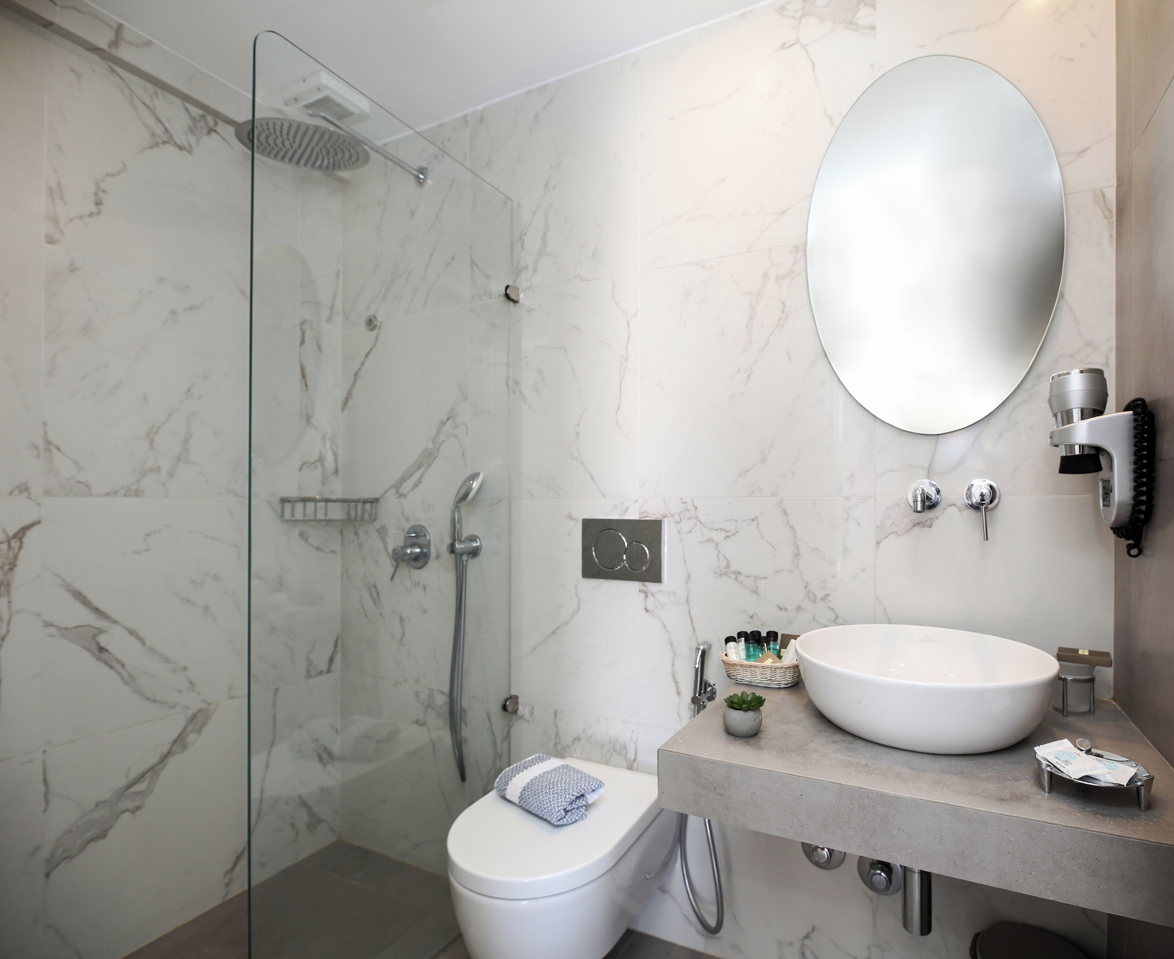 family room | bathroom | eco-friendly toiletries, hair dryer, slippers, towels