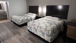 A hotel room with two beds, a desk, and a chair. - Motel 6 Oklahoma City, OK - Fairgrounds West (Oklahoma City)