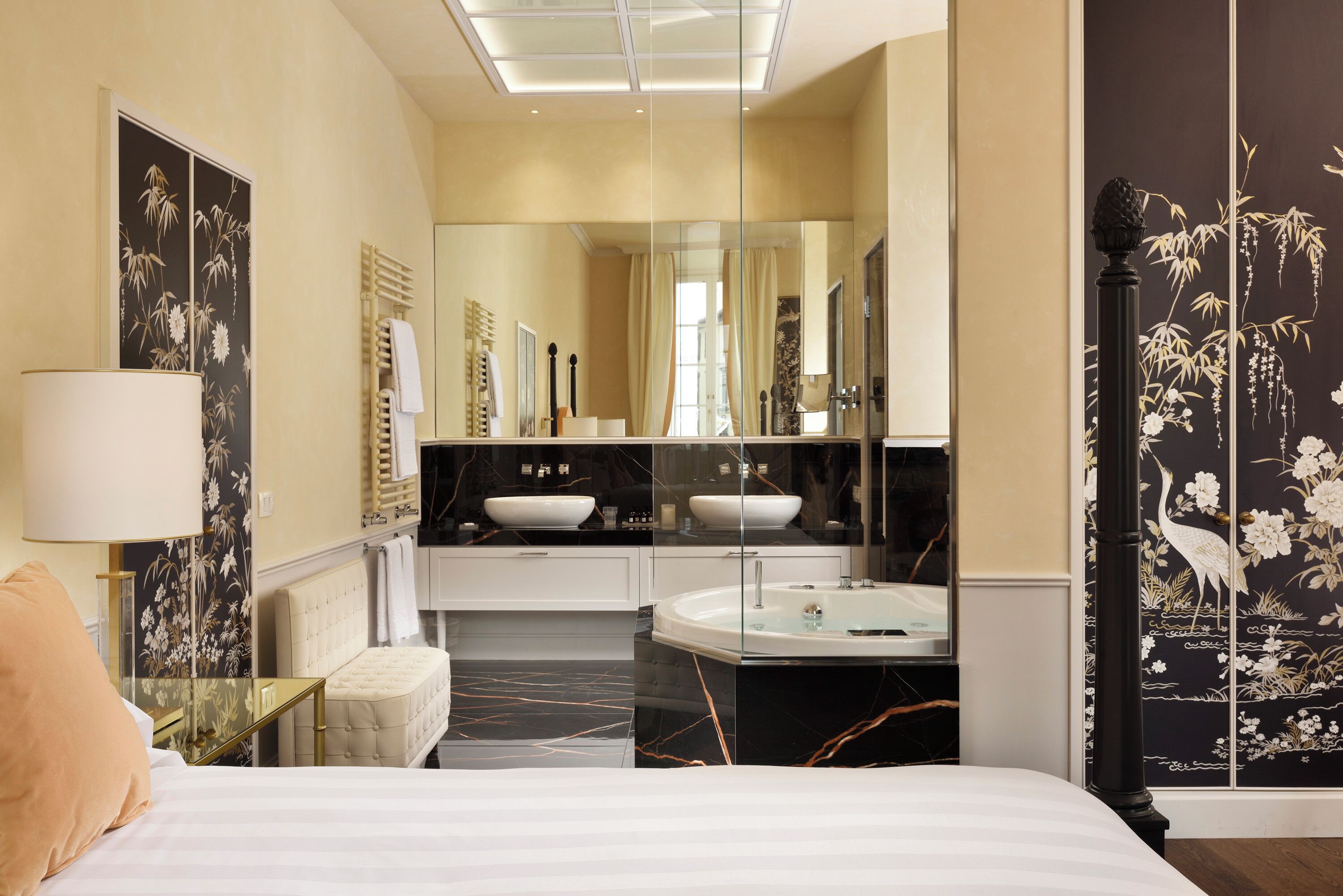 luxury suite, 1 king bed, hot tub, city view | bathroom | rainfall showerhead, hair dryer, bathrobes, slippers