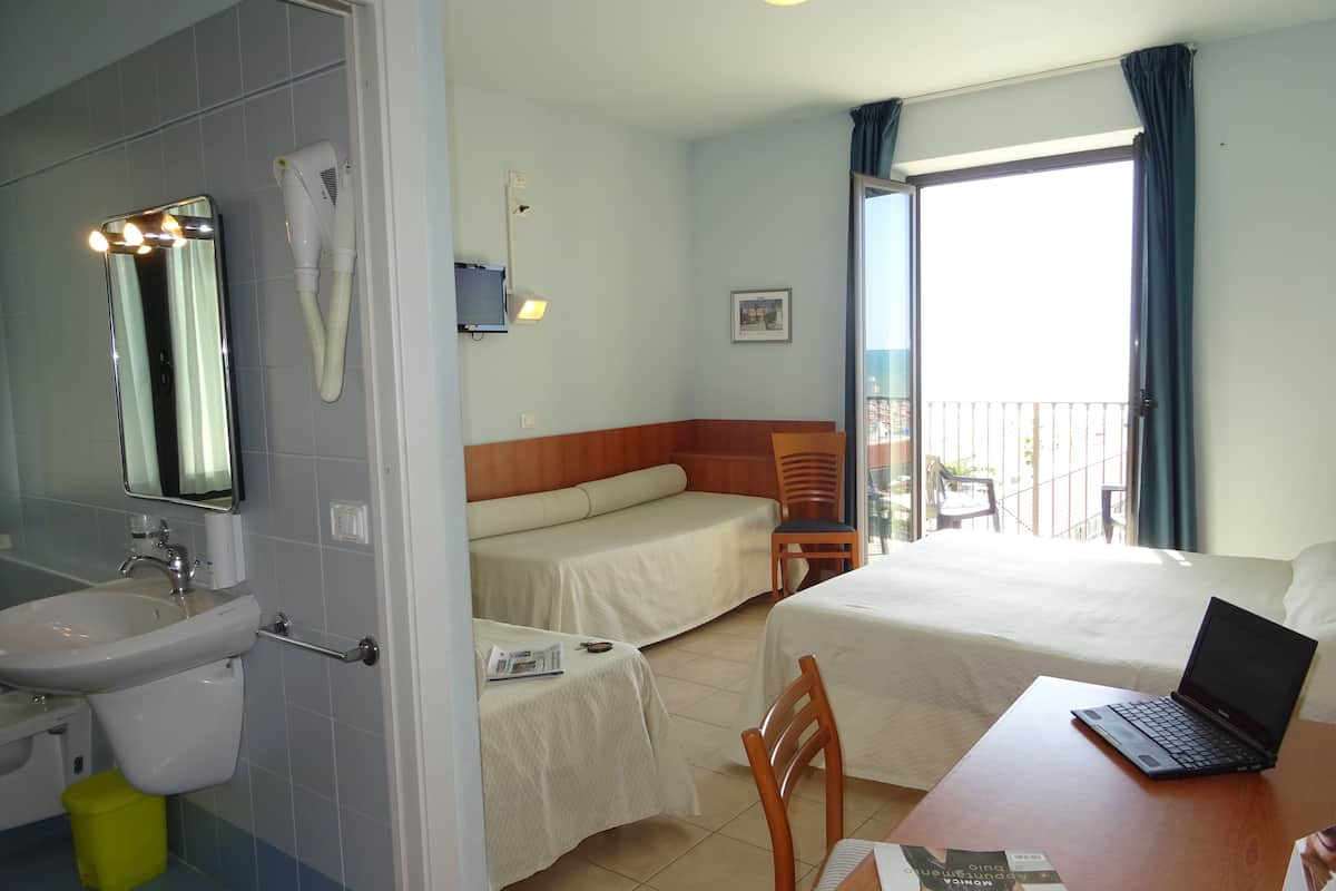 quadruple room, balcony, sea view | minibar, in-room safe, desk, blackout curtains