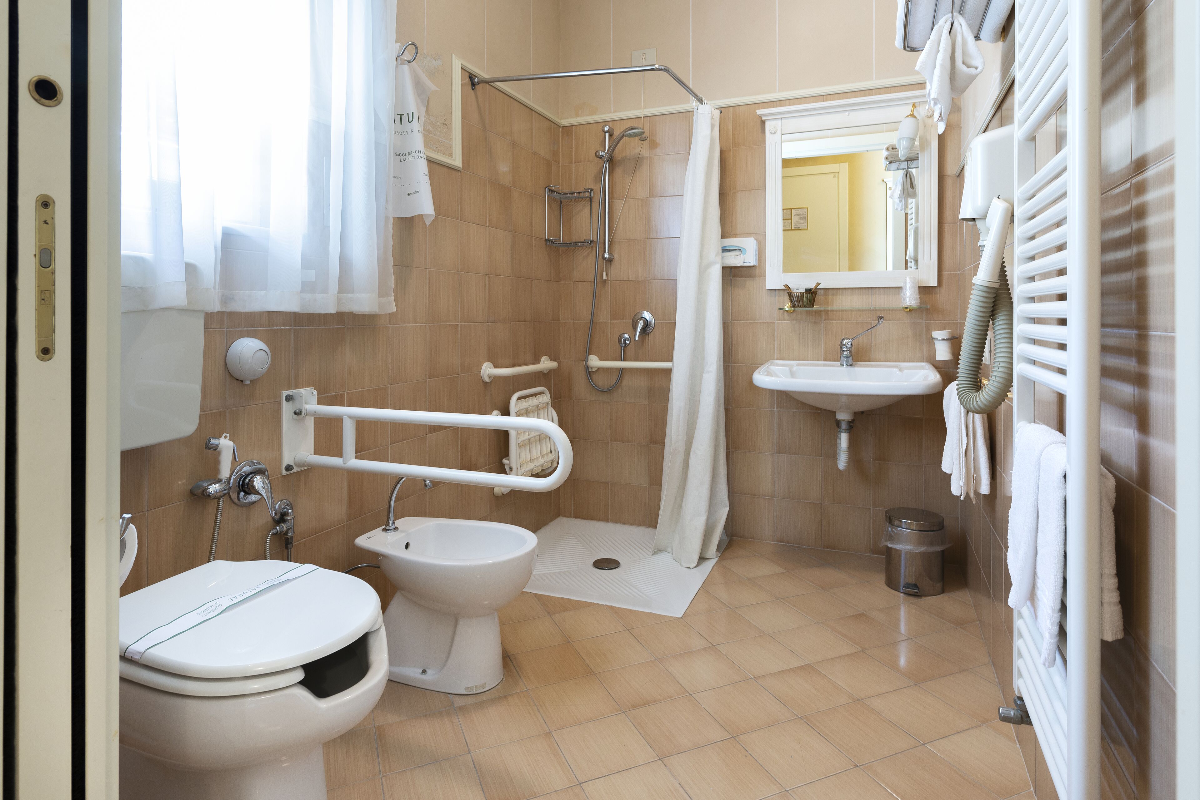 standard twin room, accessible | bathroom | shower, free toiletries, hair dryer, bidet
