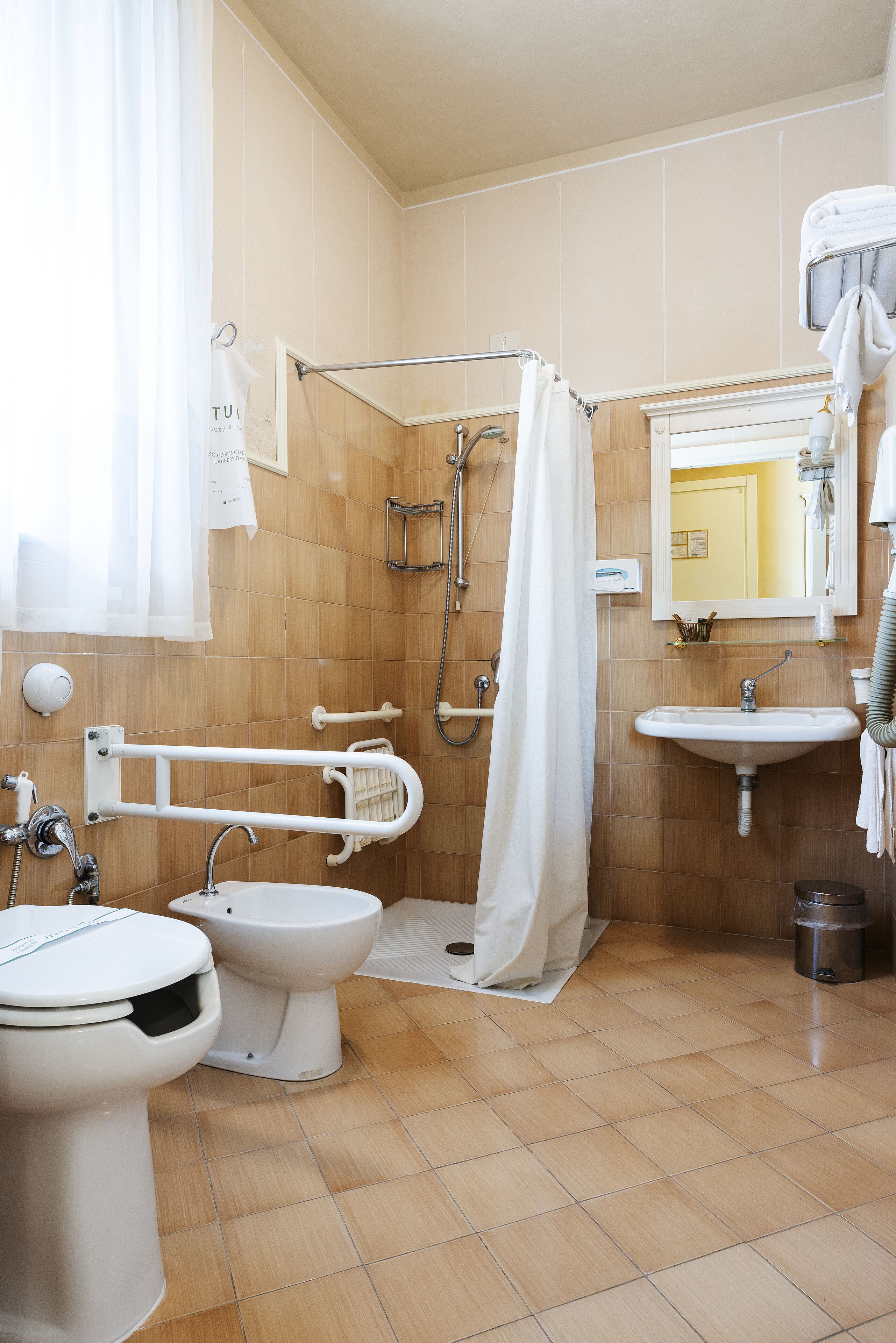 standard twin room, accessible | bathroom | shower, free toiletries, hair dryer, bidet