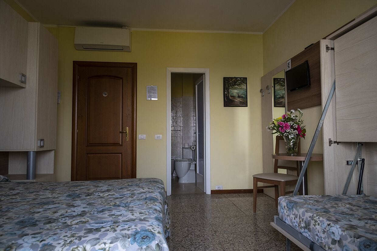 standard triple room, lake view | in-room safe, desk, free cots/infant beds, rollaway beds