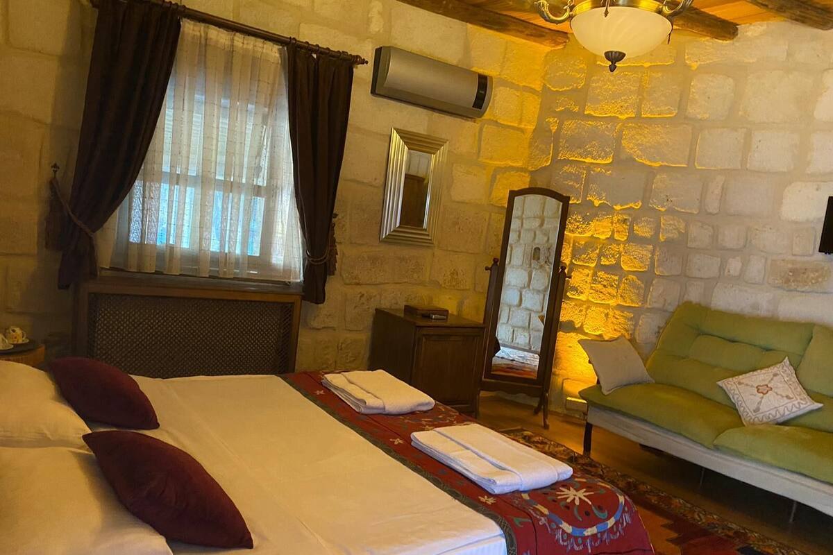 Family Triple Room, 1 Bedroom, Courtyard Area | Minibar, in-room safe, WiFi (free), bed sheets