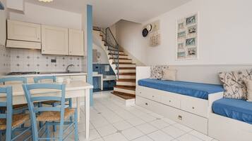Apartment, 1 Bedroom (Thury) | Living area | 21-inch TV with satellite channels