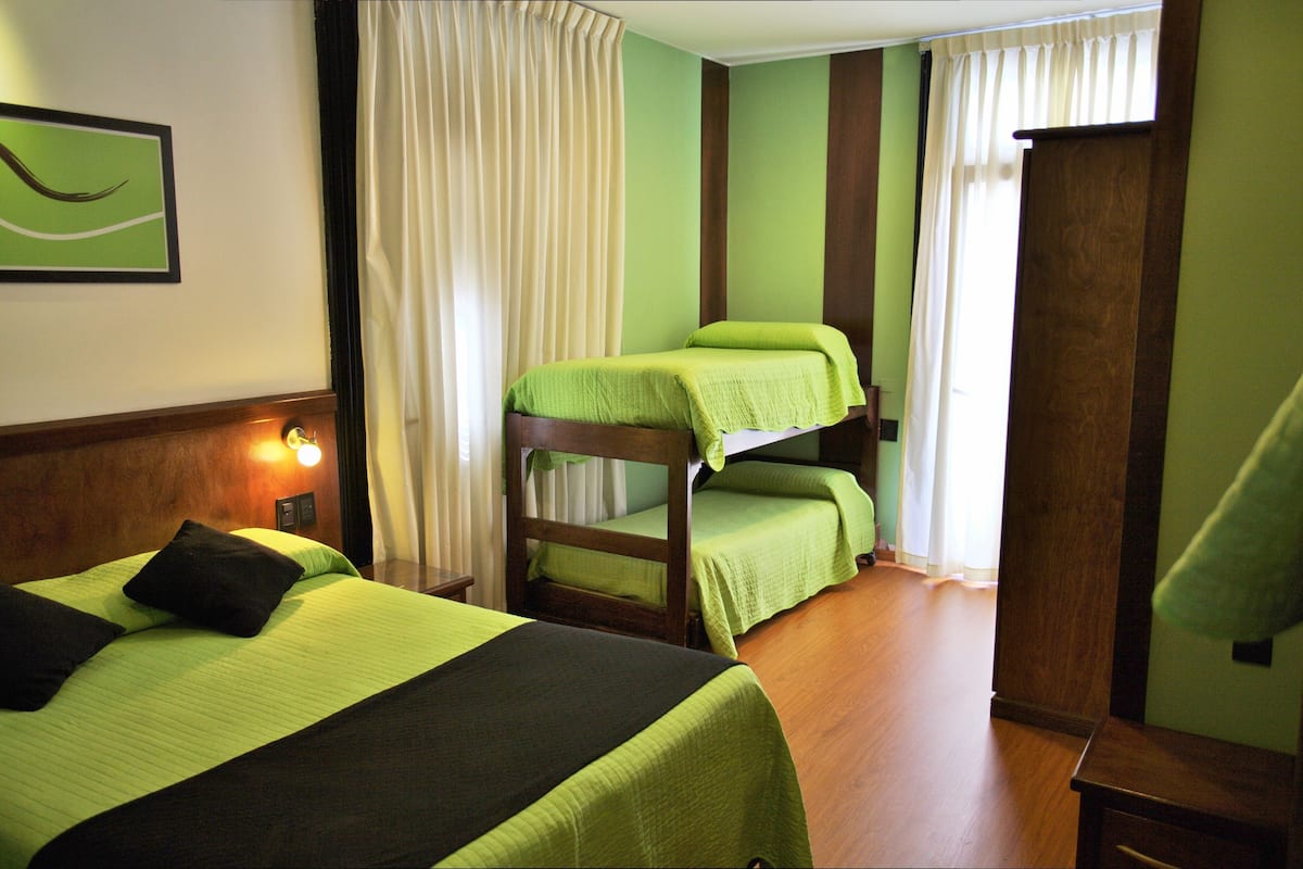 Family Room | Pillowtop beds, minibar, in-room safe, laptop workspace