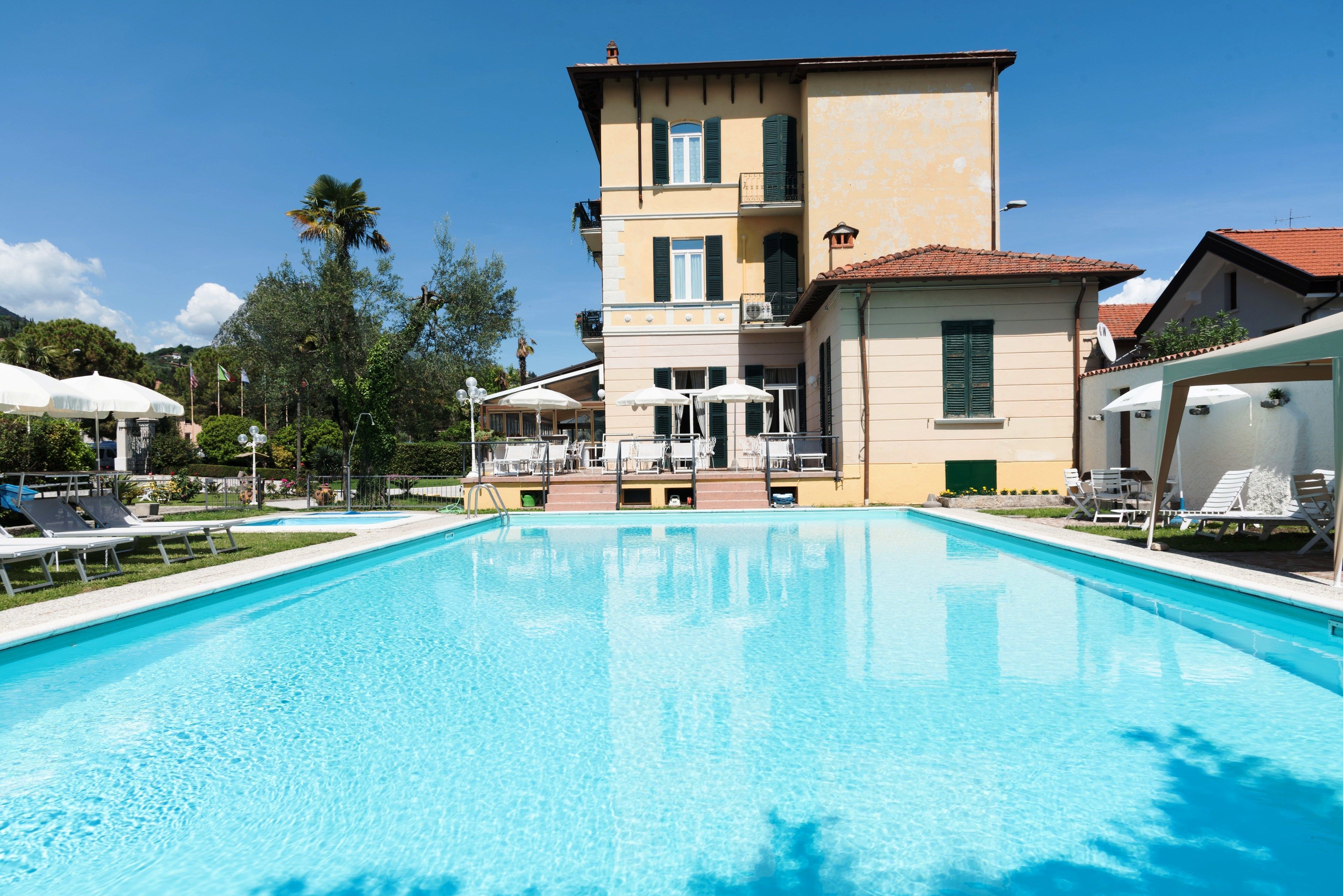 outdoor pool, pool umbrellas, pool loungers