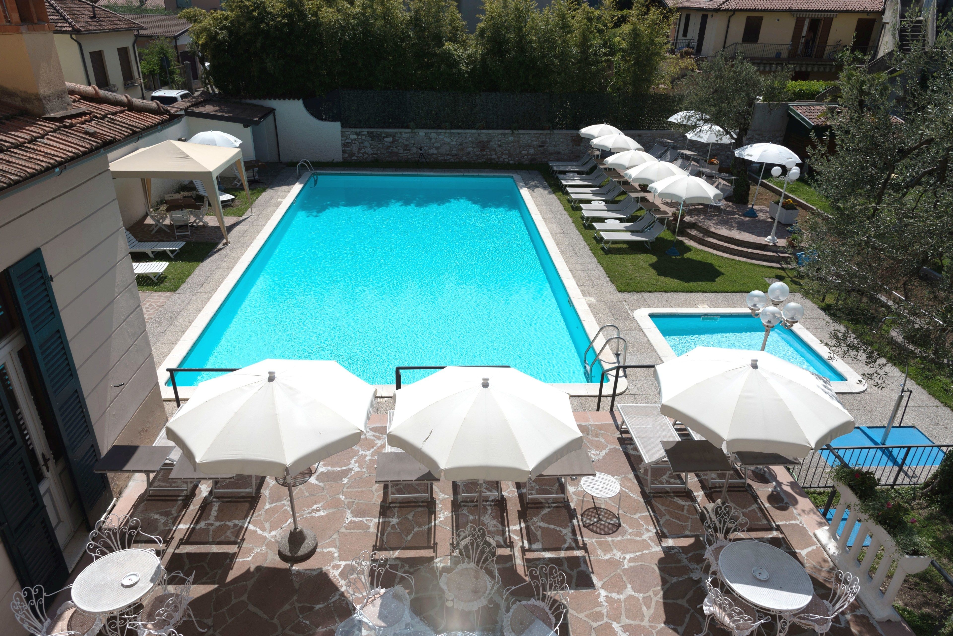 outdoor pool, pool umbrellas, pool loungers