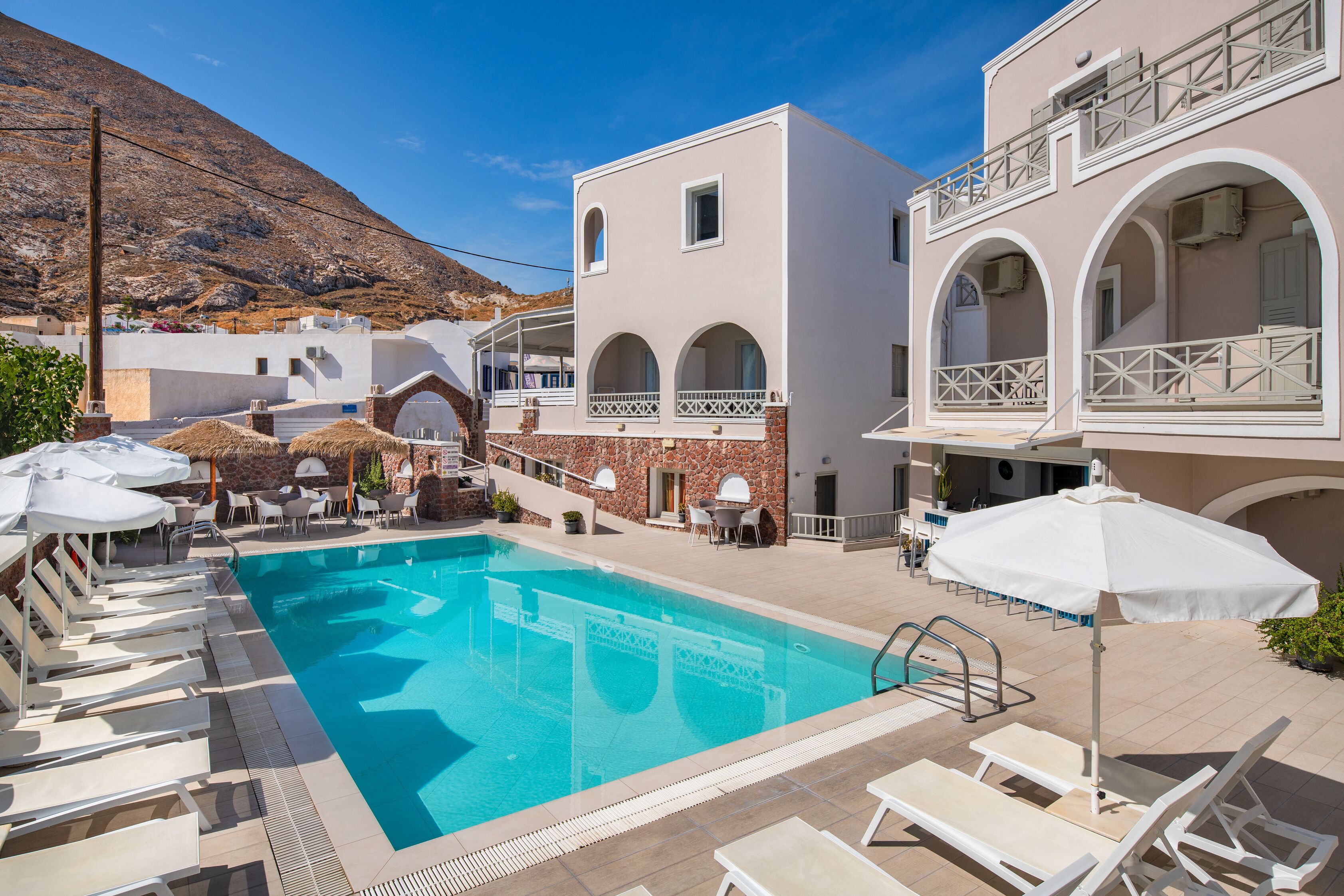 seasonal outdoor pool, pool umbrellas, pool loungers