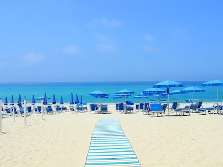 Private beach, sun-loungers, beach umbrellas, beach towels. Blu Tropical Resort