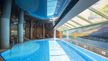 Indoor pool, seasonal outdoor pool, open 8 AM to 8 PM, pool umbrellas