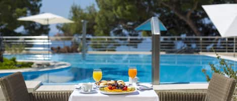 Indoor pool, seasonal outdoor pool, open 8 AM to 8 PM, pool umbrellas