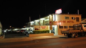 A motel with a sign reading "A&A Lodge Motel" and a truck parked in front. - A & A Lodge Motel Emerald (Emerald)