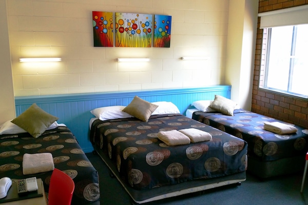 Family Room | Desk, blackout curtains, iron/ironing board, free WiFi