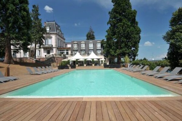 Seasonal outdoor pool, pool loungers