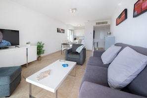 Superior Apartment, 2 Bedrooms, Sea View | Living area | 43-inch LED TV with digital channels, TV, DVD player - Nemea Appart Hotel Le Lido Cagnes sur Mer (Cagnes-sur-Mer)