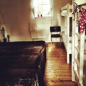 Family Room | Desk, laptop workspace, iron/ironing board, cots/infant beds