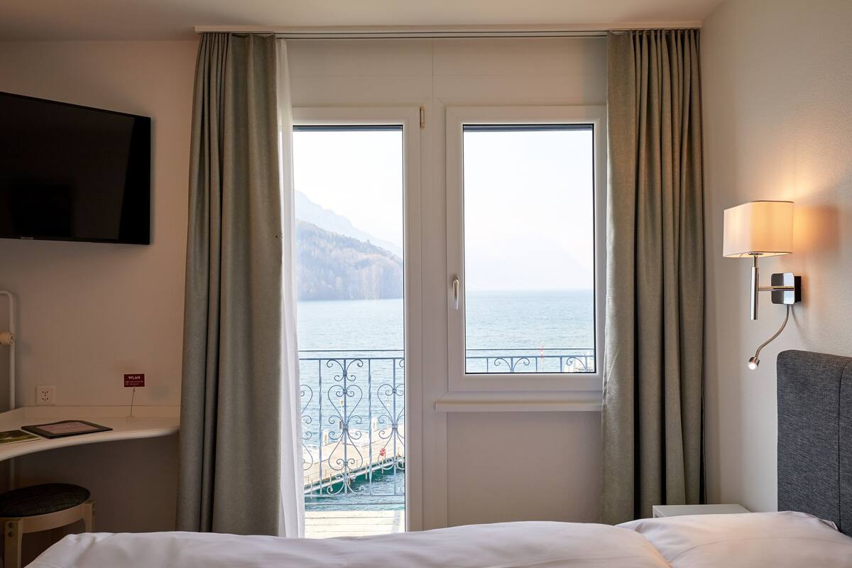 standard double room, lake view | minibar, in-room safe, blackout curtains, rollaway beds