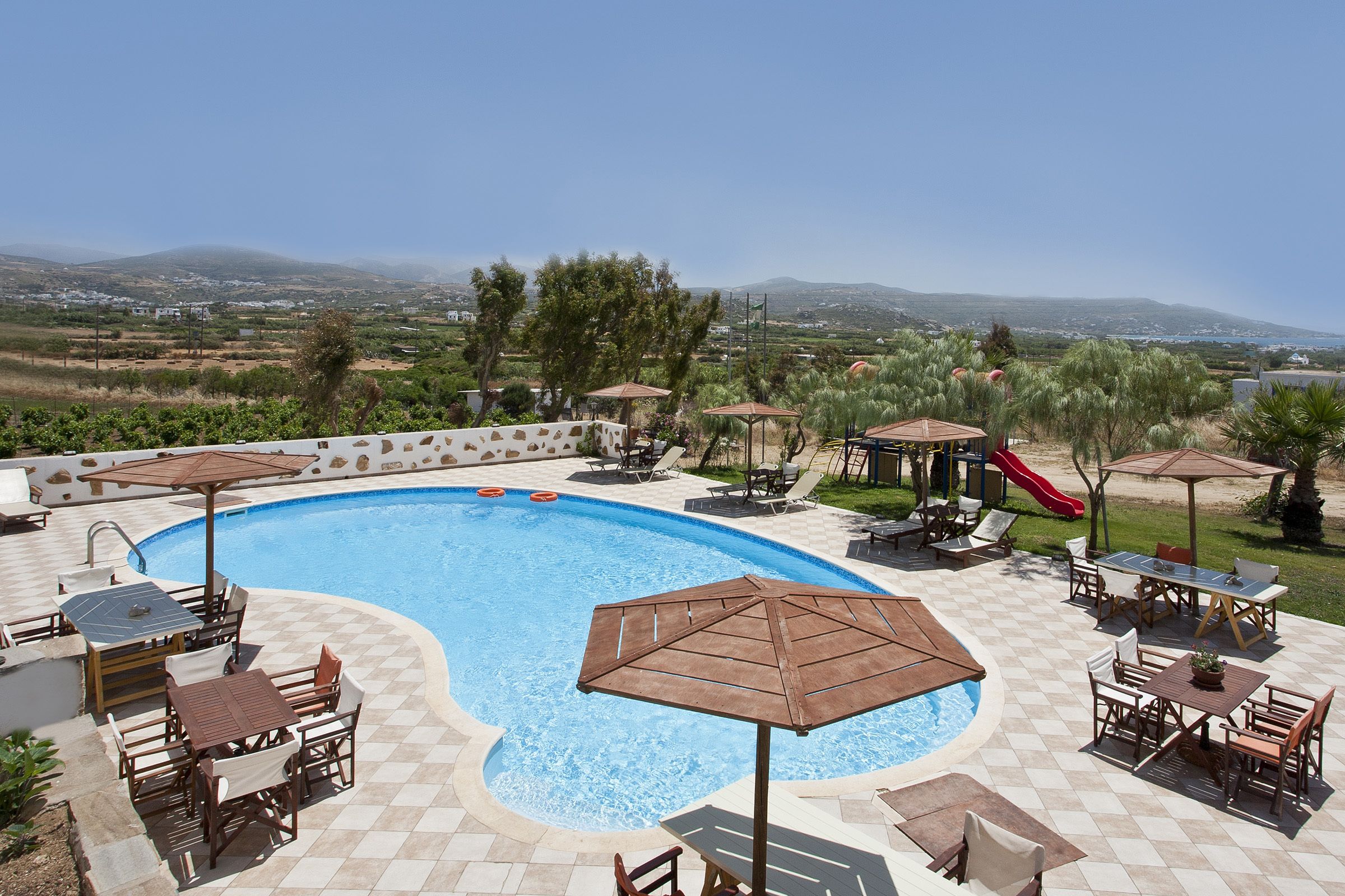 outdoor pool, pool umbrellas, pool loungers