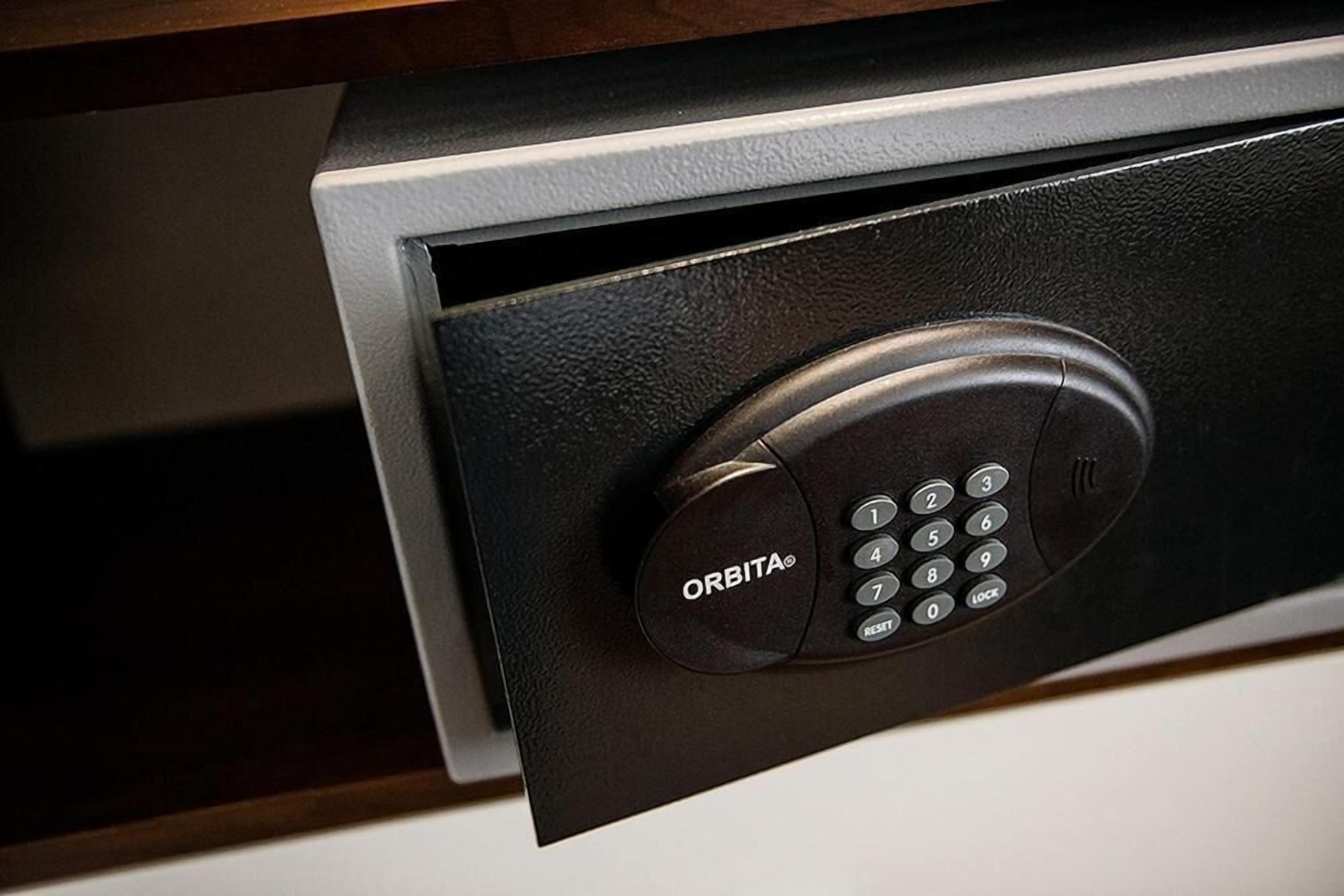 A black electronic keypad with the brand name "ORBITA" on a door.