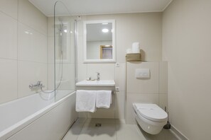 Bathtub, hair dryer, towels