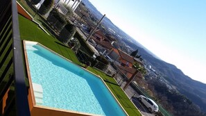 Outdoor pool, open 8:00 AM to 7:00 PM, pool umbrellas