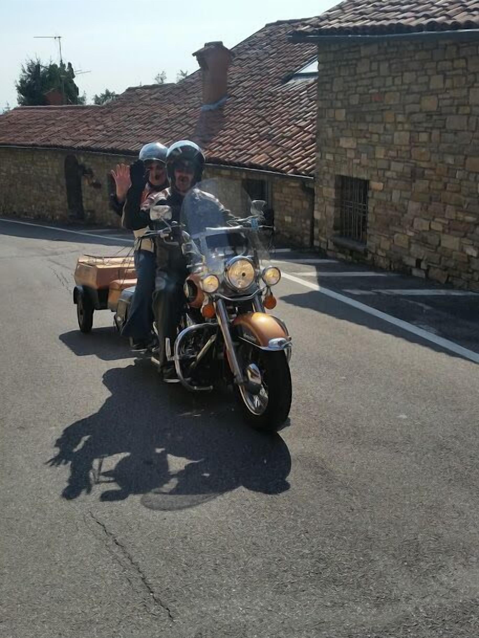 A vintage motorcycle with a sidecar parked on a street.