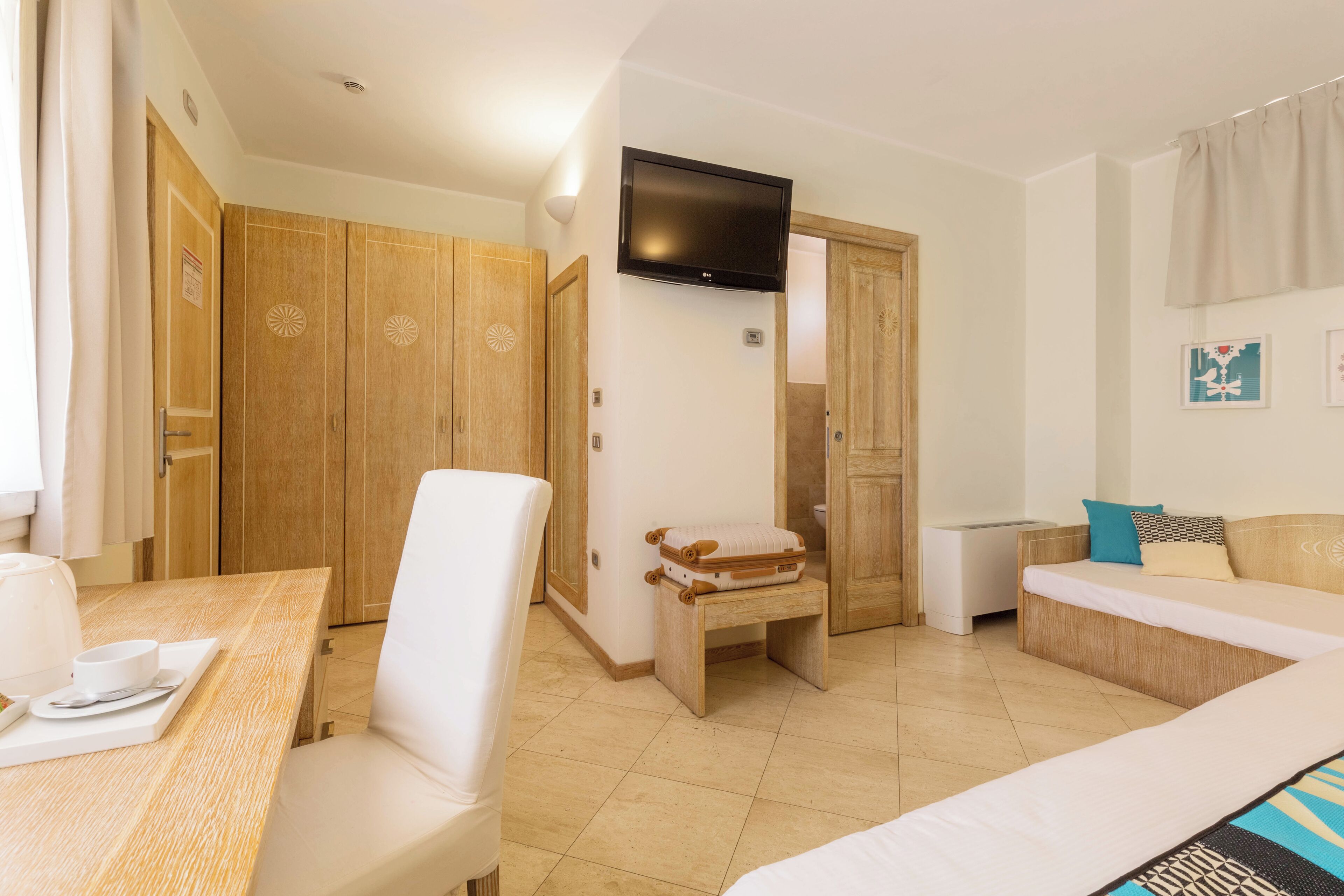 family room | 1 bedroom, minibar, in-room safe, desk