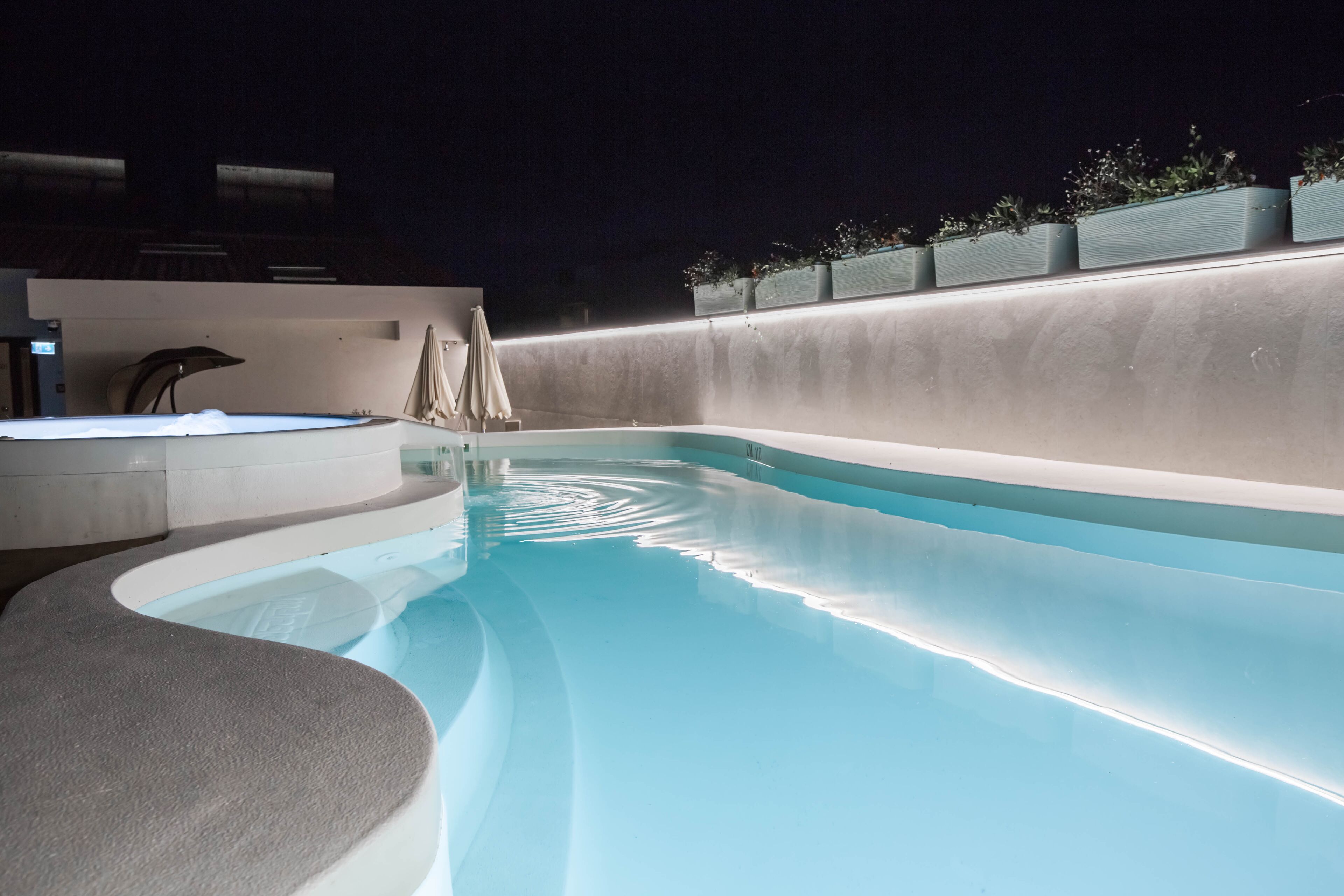 seasonal outdoor pool, open 11:00 am to 7:00 pm, pool umbrellas