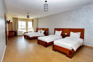 Quadruple Room | Premium bedding, in-room safe, desk, blackout curtains