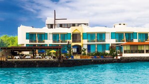 A large resort with multiple buildings, a pool, and outdoor seating areas. - Hotel Solymar (Puerto Ayora)