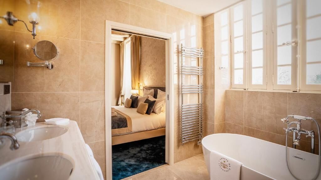 superior suite | bathroom | designer toiletries, hair dryer, bathrobes, slippers
