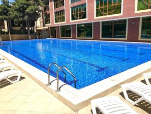 Seasonal outdoor pool, pool umbrellas, sun loungers