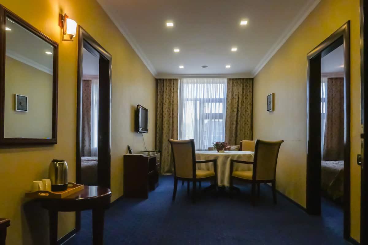 Family Suite, 2 Bedrooms, Smoking | Living room | LCD TV