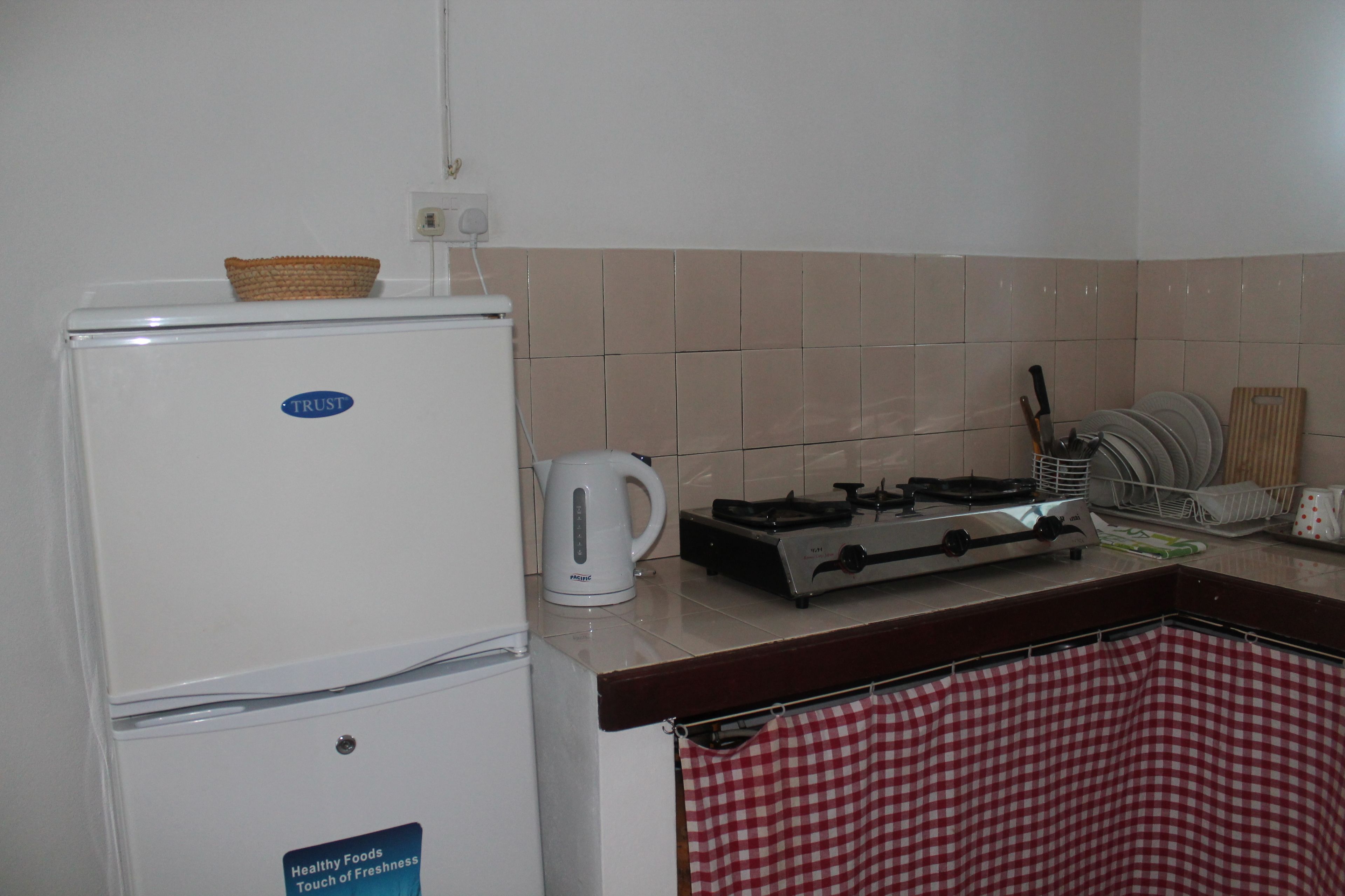 standard twin room | private kitchenette | full-sized fridge, microwave, electric kettle, cookware/dishes/utensils